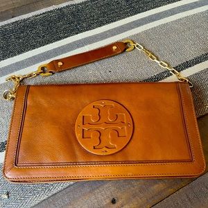 Beautiful Tory Burch Clutch, rich saddle color. Has removable strap & dust bag.